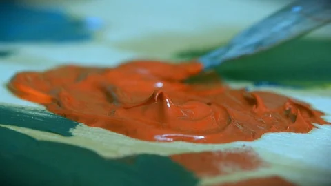 Paint red are mixed with a brush close-up. Stock Footage 92294728