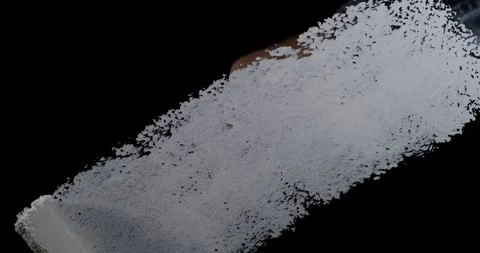 Paint roller applies white coating to dark surface as DIY project takes sha.. Stock Footage 348444829