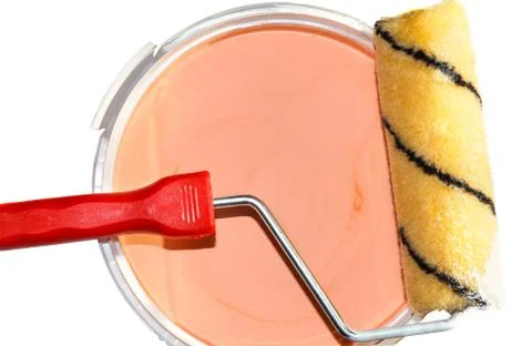 Paint roller on a bucket with paint Stock Photos