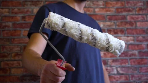 Paint roller in hand 4K Video stock 150287563