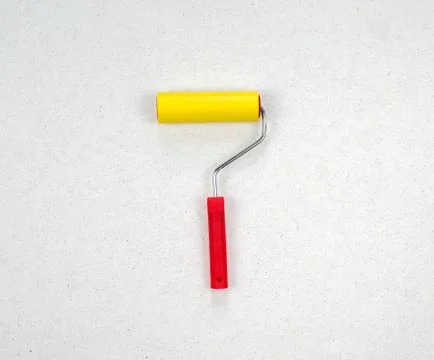 Paint roller with handle and smooth nozzle isolated on light background. Stock Photos