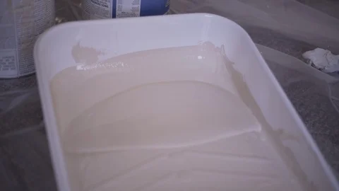 Paint Roller Holder With Light Brown Paint Handheld Shot Stock Footage 88013510