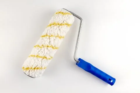 The paint roller is isolated on a white background. Stock Photos