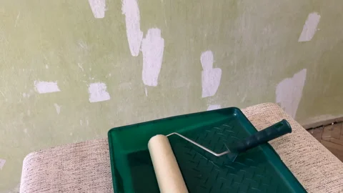 Paint roller with paint in container room. Stock Footage 270309164