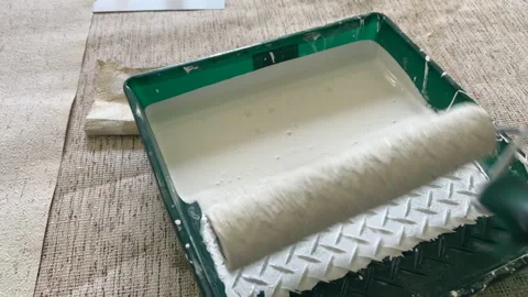 Paint roller with paint in container room. Stock Footage 273109397