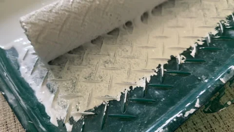 Paint roller with paint in container room. Stock Footage 273110064