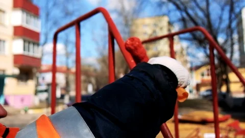 Paint roller painting elements of the playground in red Video stock 129095077
