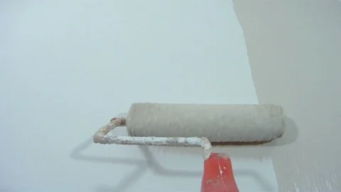 Paint roller POV shot while painting a wall Stock Footage 105269077