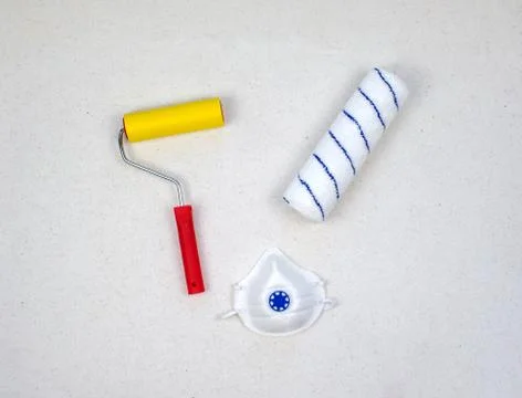Paint roller with red handle, yellow smooth and soft velour nozzles with medi Stock Photos