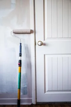 Paint roller on the wall Фото
