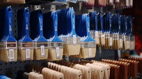 Paint rollers. Goods in a building materials store. June 24, 2022 Beltsy Moldova Stock Footage 232124601
