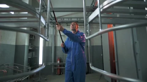 Paint shop foreman prepares items for painting in the paint shop Stock Footage 179705538