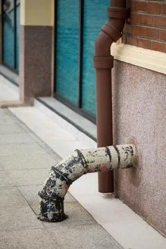 A paint-splattered pipe endures. Stock Photos