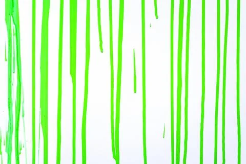 Paint streams on a  light green surface. A background with  strips from col.. Stock Photos