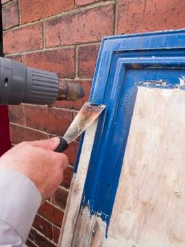 Paint stripping kitchen cupboards Stock Photos