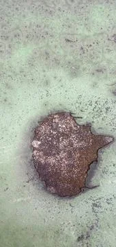 The paint surface on the cement wall is starting to peel off Photos
