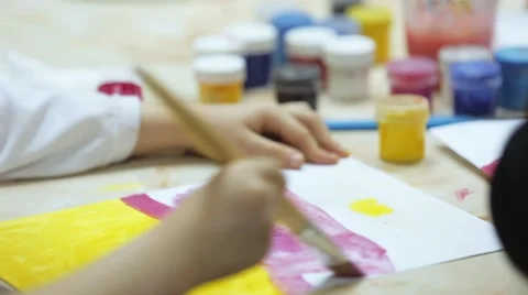 Paint two brush and paints on paper Stock Footage 59589300