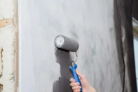 Paint the walls gray with a roller Stock Photos