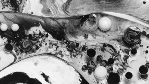 Paint, water an oil react chemically in an Acrylic paint pouring footage. Stock Footage 343900762
