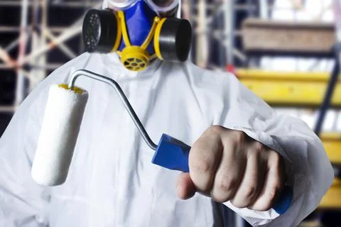Paint worker with roller. Stock Photos