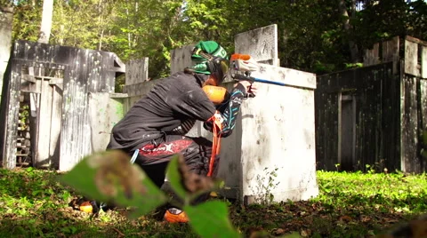 Paintball sliding to safety Stock Footage 63553129