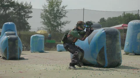 Paintballplayer falls after he gets hit on the Field Stock Footage 66447218