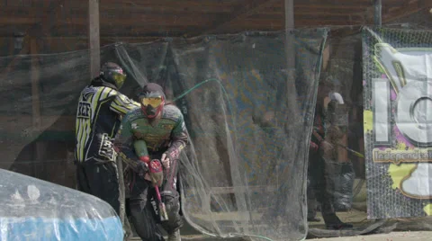 Paintballplayer walks on the Field Stock Footage 66442662