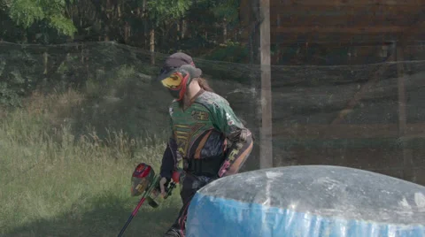 Paintballplayer walks on the Field Stock Footage 66450189