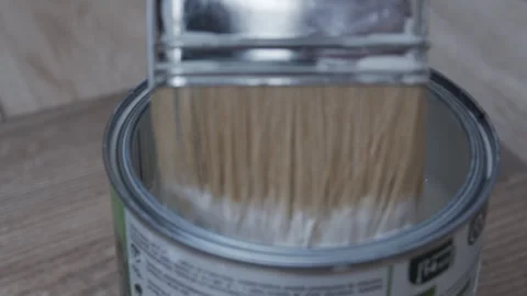 Paintbrush and dipping it into white paint. Stock Footage 333320308