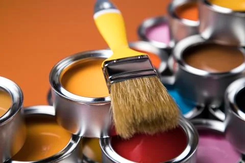 Paintbrush on cans with color Free Stock Photos