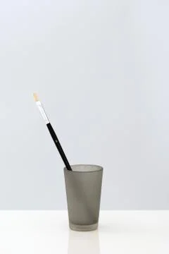 Paintbrush in cup, close-up Stock Photos