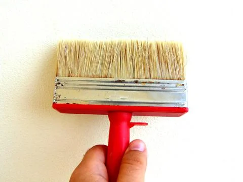 Paintbrush in a hand - work Stock Photos