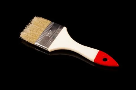 Paintbrush isolated on dark background Stock Photos