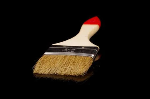 Paintbrush isolated on dark background Stock Photos