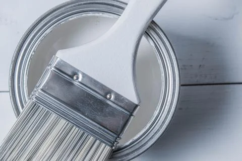 Paintbrush on the paint can Stock Photos