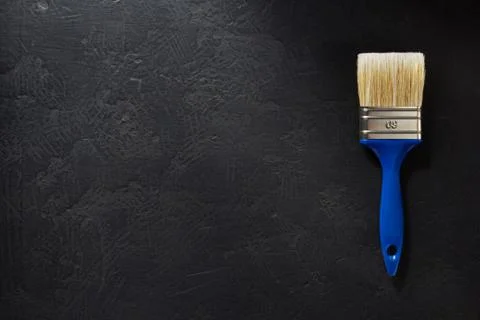Paintbrush tool at black background Stock Photos