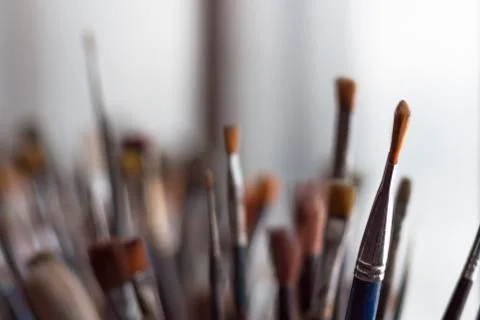 Paintbrushes by the window Stock Photos