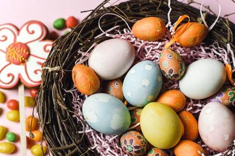 Painted and decorative eggs for the Easter holiday in a nest of branches ne.. Stock Photos