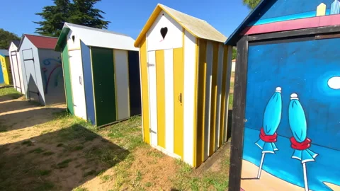 Painted beach huts of the beach of La Boirie on Oleron island, France Stock Footage 276834450