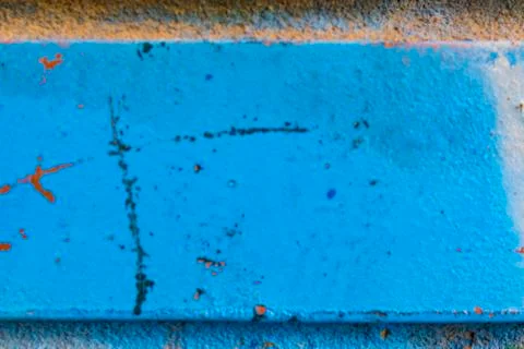 Painted with blue paint brick on a wall macro background. Stock Photos