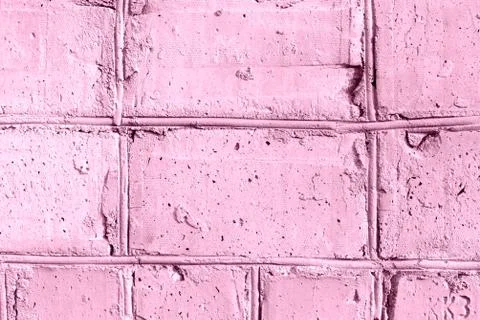 Painted brick wall texture close-up. Abstract background pink color toned Stock Photos