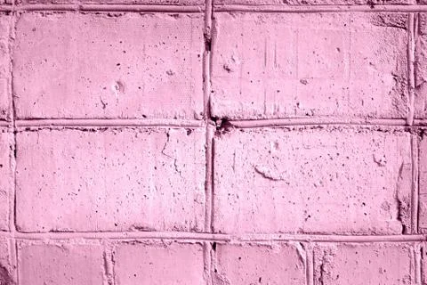Painted brick wall texture close-up. Abstract background pink color toned Stock Photos