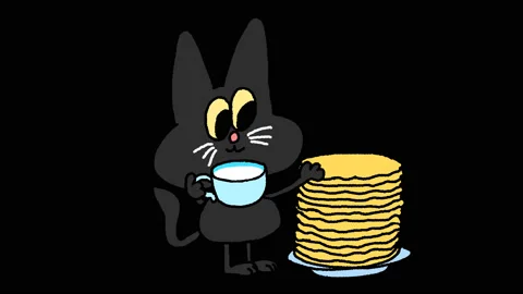 The Painted cat eats pancakes and drinks milk on Shrovetide (Pancake Week) Stock-Footage 125622997