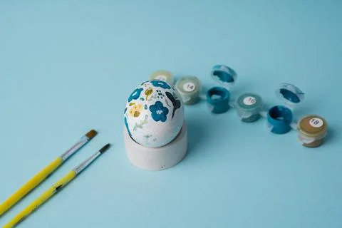 Painted chicken egg in floral pattern. DIY craft for easter holidays with kids Stock Photos