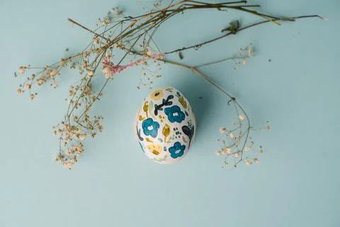 Painted chicken egg in floral pattern. DIY craft for easter holidays with kids Stock Photos