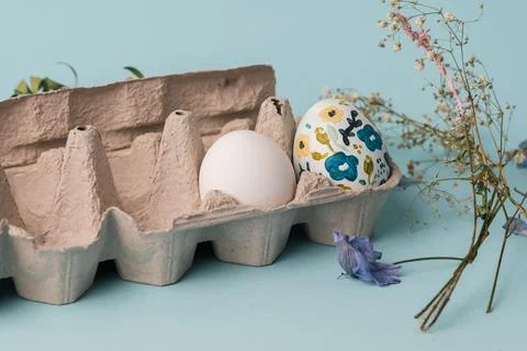 Painted chicken egg in floral pattern. DIY craft for easter holidays with kids Stock Photos
