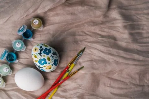 Painted chicken egg in floral pattern. DIY craft for easter holidays with kids Stock Photos