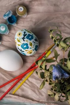 Painted chicken egg in floral pattern. DIY craft for easter holidays with kids Stock Photos