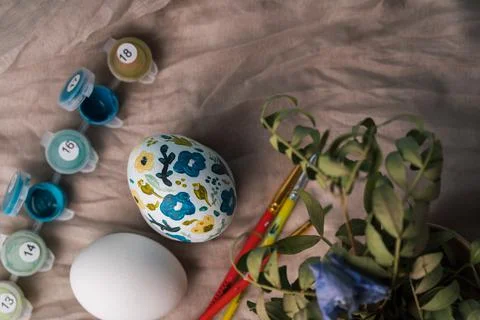 Painted chicken egg in floral pattern. DIY craft for easter holidays with kids 写真素材