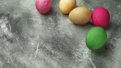 Painted chicken eggs. the egg rolls Stock Footage 121932998